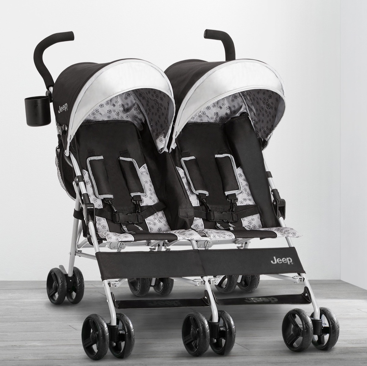 Jeep Scout Double Stroller in Charcoal Galaxy, front view showing both extended canopies and five-point harnesses