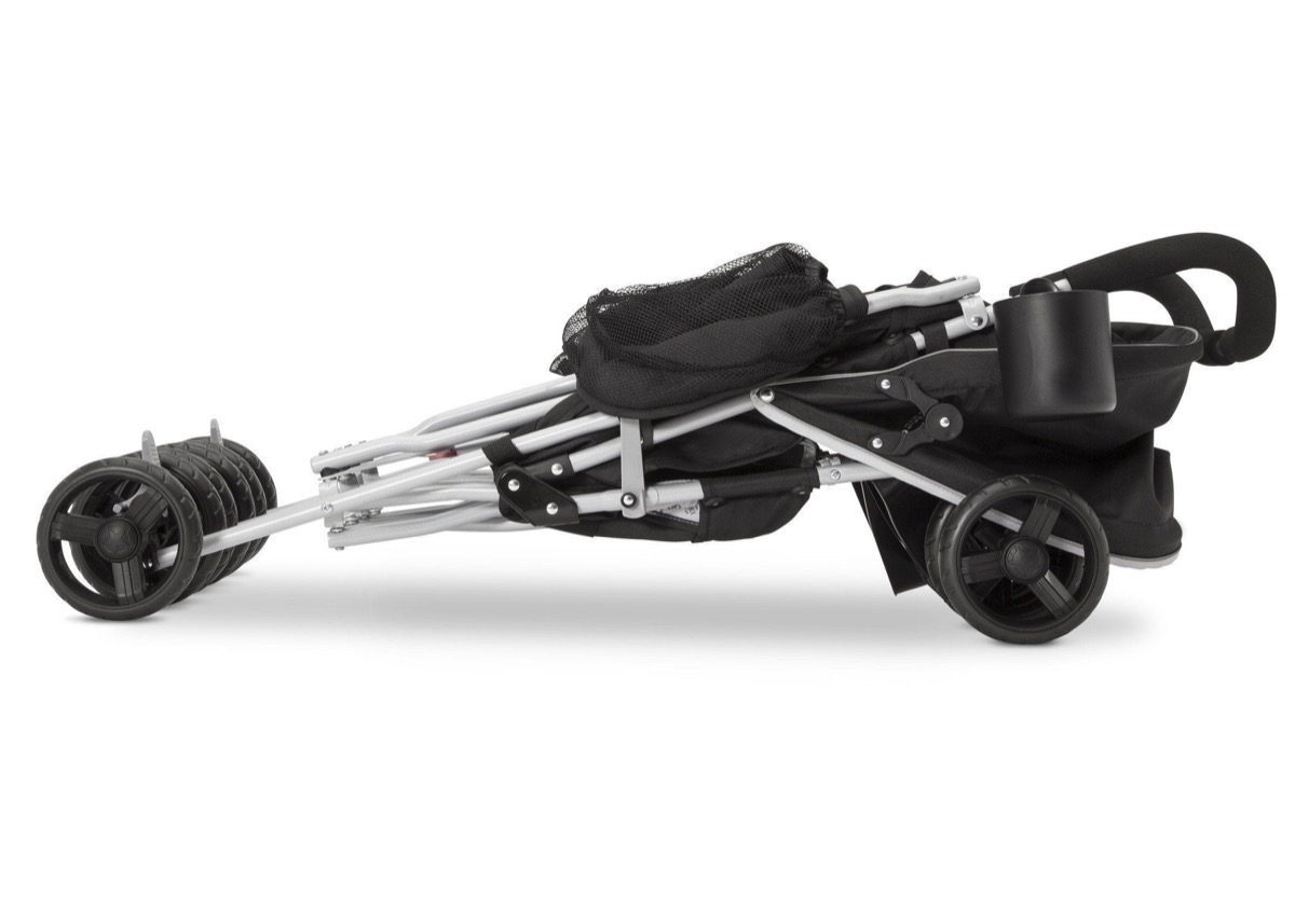 Jeep Scout Double Stroller in Charcoal Galaxy, folded and resting on its wheels for compact storage