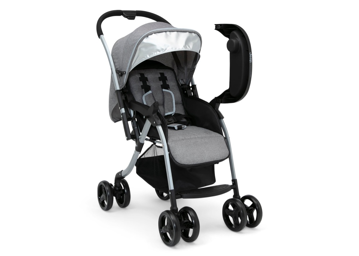 Official Delta Children product-page studio photo of the Jeep Unlimited Reversible Handle Stroller in the Grey Tweed colorway, third studio angle