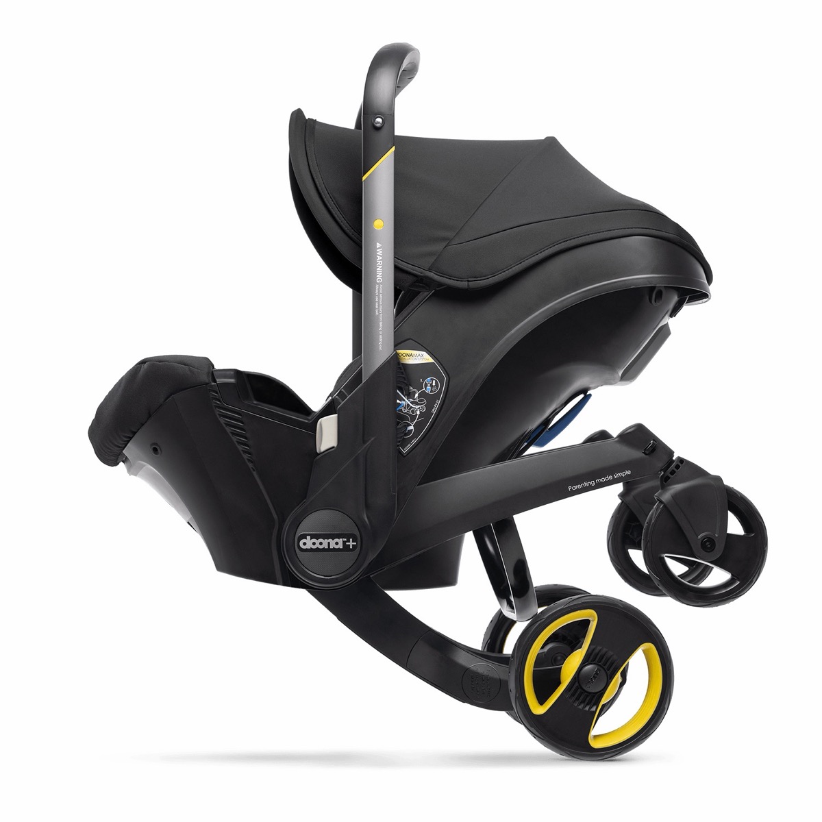 Doona + in Nitro Black with the handlebar rotated to a carry position