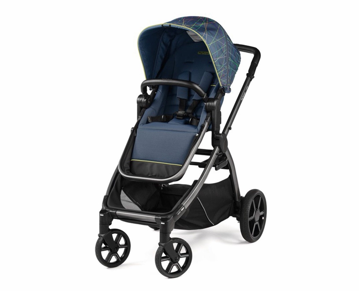 Peg Perego Ypsi single stroller in a navy colorway with a geometric-line canopy print, three-quarter front view on a white background